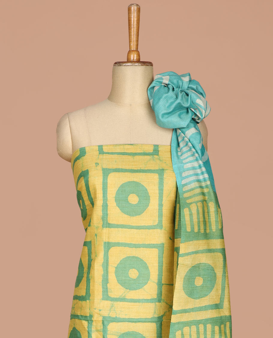 Lemon yellow with green geometric batik print bhagalpur cotton chudidhar material top with batik print cotton pants & batik print mul mul dupatta