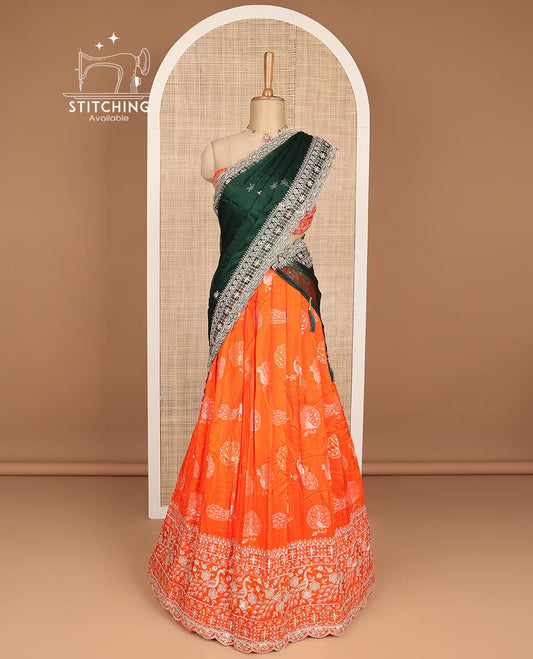 Orange peacocok buttas embroidery tissue half saree with self embroidery border, zari design blouse & floral vine design dhavani
