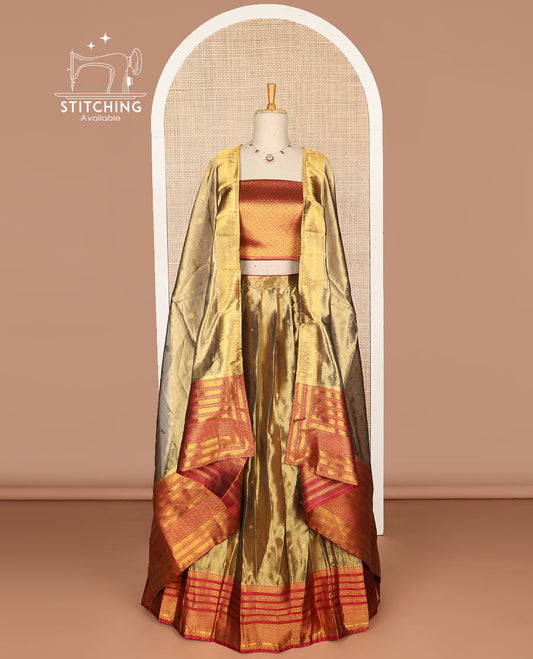 Bronze color floral buttas tissue half saree with contrast zari design border, floral design blouse & floral design dhavani