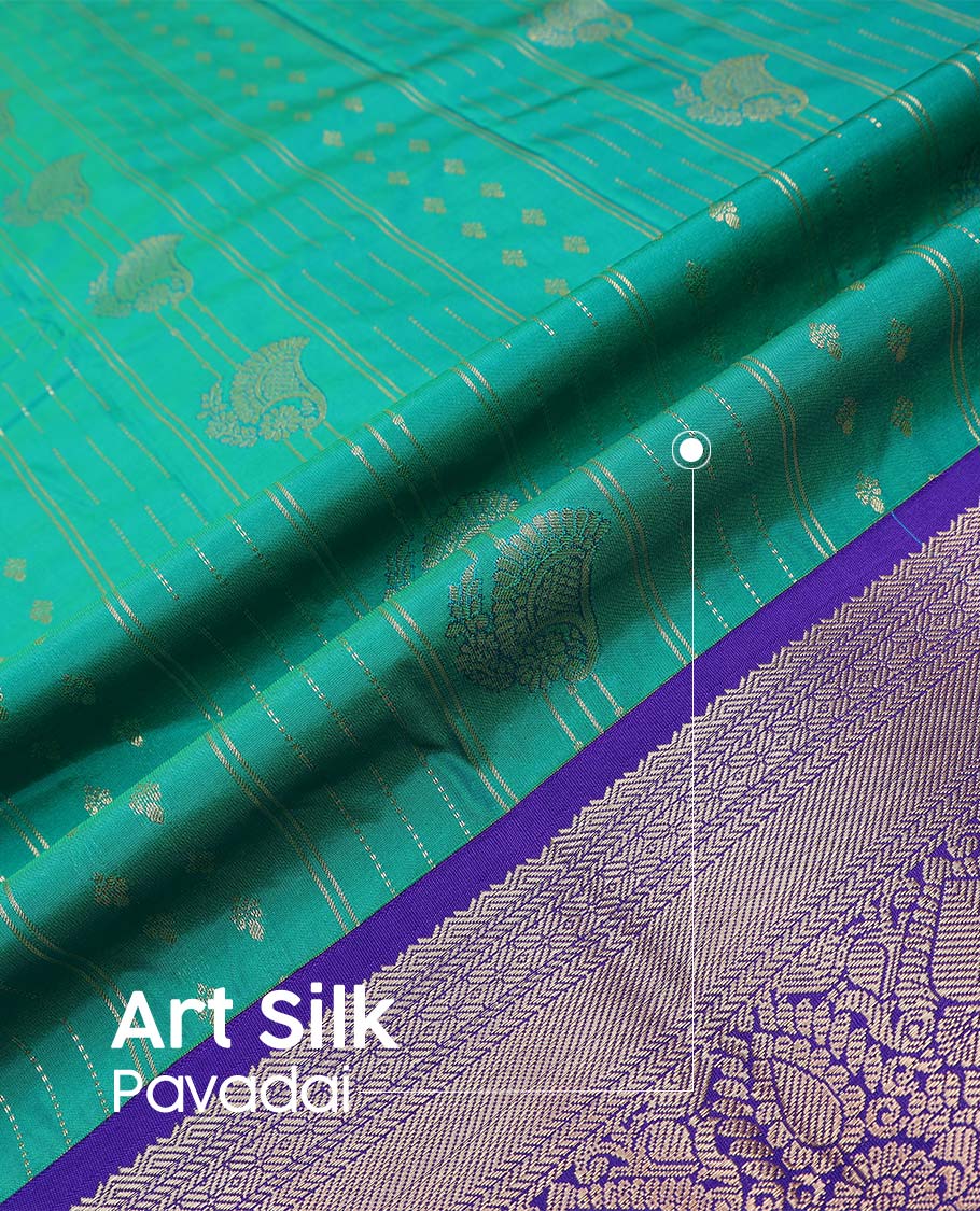 Green art silk pavadai material, zari design with contrast traditional zari bordered skirt, and a contrast bordered blouse