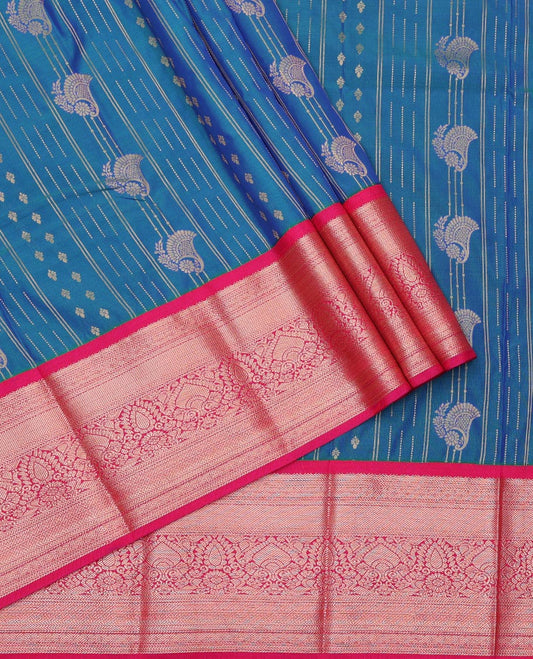Blue Art Silk Pavadai Material Set, Gleamed Up with Zari Design on Its Skirt, Complemented by a Contrast Traditional Zari Design Border, and Paired with a Contrast Blouse