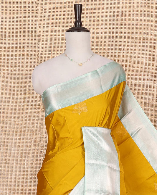 Yellow Budget Silk Saree, Delicately Woven with Zari Buttas on Its Body, Complemented by a Contrast Traditional Zari Design Border, Grand Diagonally Striped Pallu, and Paired with a Contrast Blouse