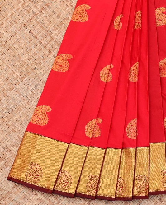 Red Budget Silk Saree, Delicately Woven with Zari Buttas on Its Body, Complemented by a Contrast Paisley Zari Border, Grand Pallu, and Paired with a Contrast Blouse