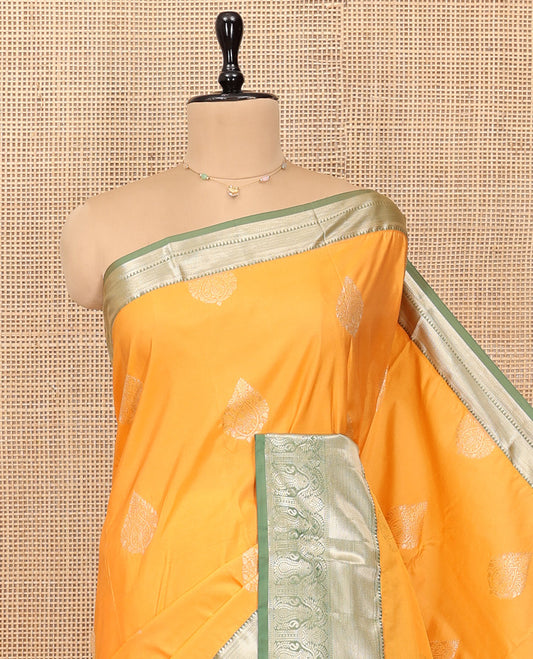 Yellow Budget Silk Saree, Subtly Sparkled with Zari Buttas, Complemented by a Contrast Traditional Zari Border, Grand Jaal Pallu, and Contrast Blouse