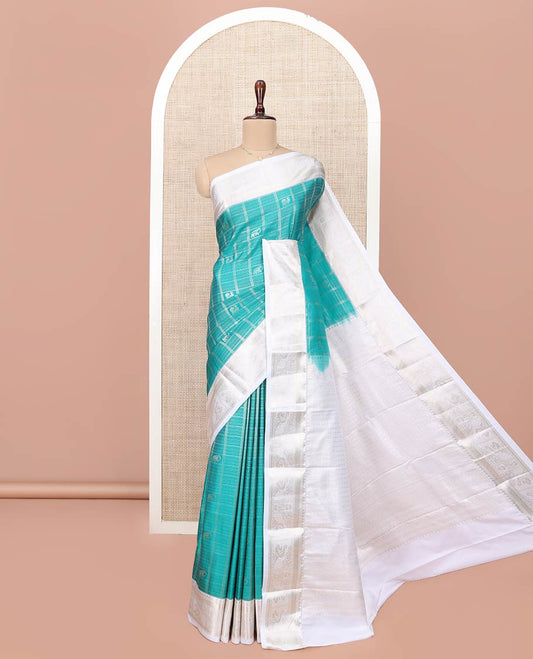 Blue Budget Silk Saree, Gleamed Up with Peacock and Elephant Buttas Enclosed Checks All Over Its Body, Complemented by a Contrast Traditional Zari Design Border, Grand Pallu of Jaal Designs, and Paired with a Contrast Blouse