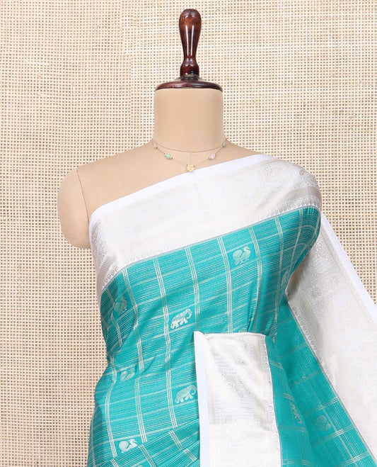 Blue Budget Silk Saree, Gleamed Up with Peacock and Elephant Buttas Enclosed Checks All Over Its Body, Complemented by a Contrast Traditional Zari Design Border, Grand Pallu of Jaal Designs, and Paired with a Contrast Blouse