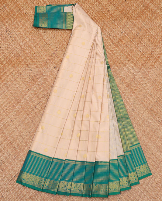 Cream Budget Silk Saree, Bedecked with Zari Butta Enclosed Checks All Over Its Body, Complemented by a Contrast Traditional Zari Design Woven Border, Gleaming Jaal Pallu, and Paired with a Contrast Blouse