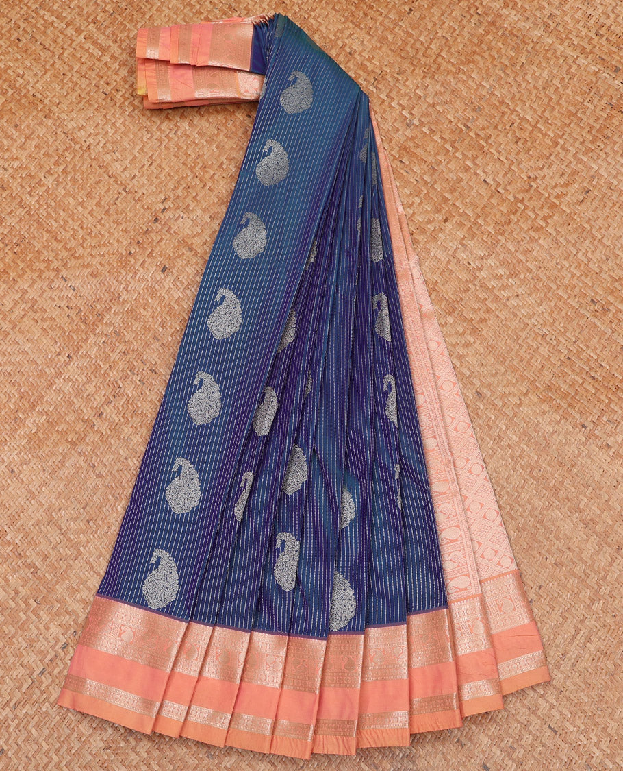 Blue Budget Silk Saree Gleamed Up with Paisley Buttas and Stripes All Over Its Body, Complemented by a Contrast Rettai Pettu Border of Traditional Zari Designs, a Grand Pallu of Jaal Designs, and Paired with a Contrast Blouse