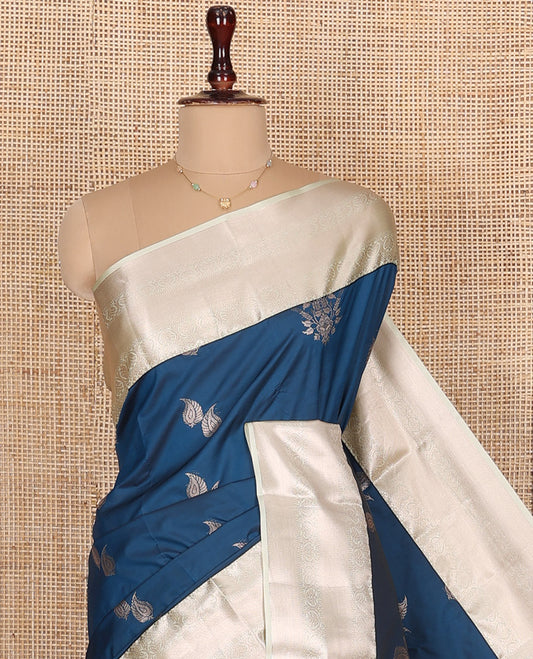 Blue Budget Silk Saree, Spotlighted with Zari Buttas All Over Its Body, Complemented by a Contrast Traditional Zari Designs Woven Border, Opulently Embellished Pallu, and Paired with a Contrast Blouse