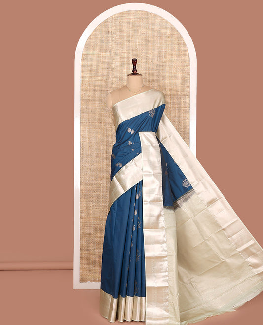 Blue Budget Silk Saree, Spotlighted with Zari Buttas All Over Its Body, Complemented by a Contrast Traditional Zari Designs Woven Border, Opulently Embellished Pallu, and Paired with a Contrast Blouse