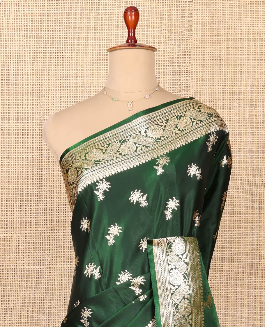Green Semi-Banaras Saree, Spotlighted with Floral Buttas on Its Body, Highlighted by a Floral Creeper Border, Intricately Designed Pallu, and Paired with a Matching Blouse