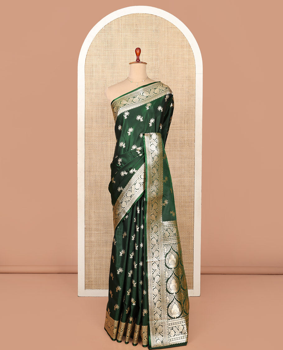 Green Semi-Banaras Saree, Spotlighted with Floral Buttas on Its Body, Highlighted by a Floral Creeper Border, Intricately Designed Pallu, and Paired with a Matching Blouse