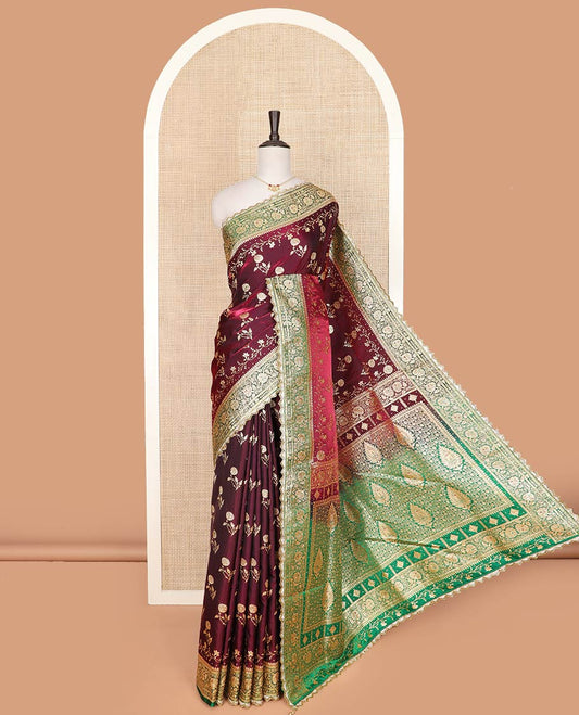 Maroon floral buttas banarasi silk saree, contrast floral creeper stone work lace border, and pallu of intricate designs and stone work
