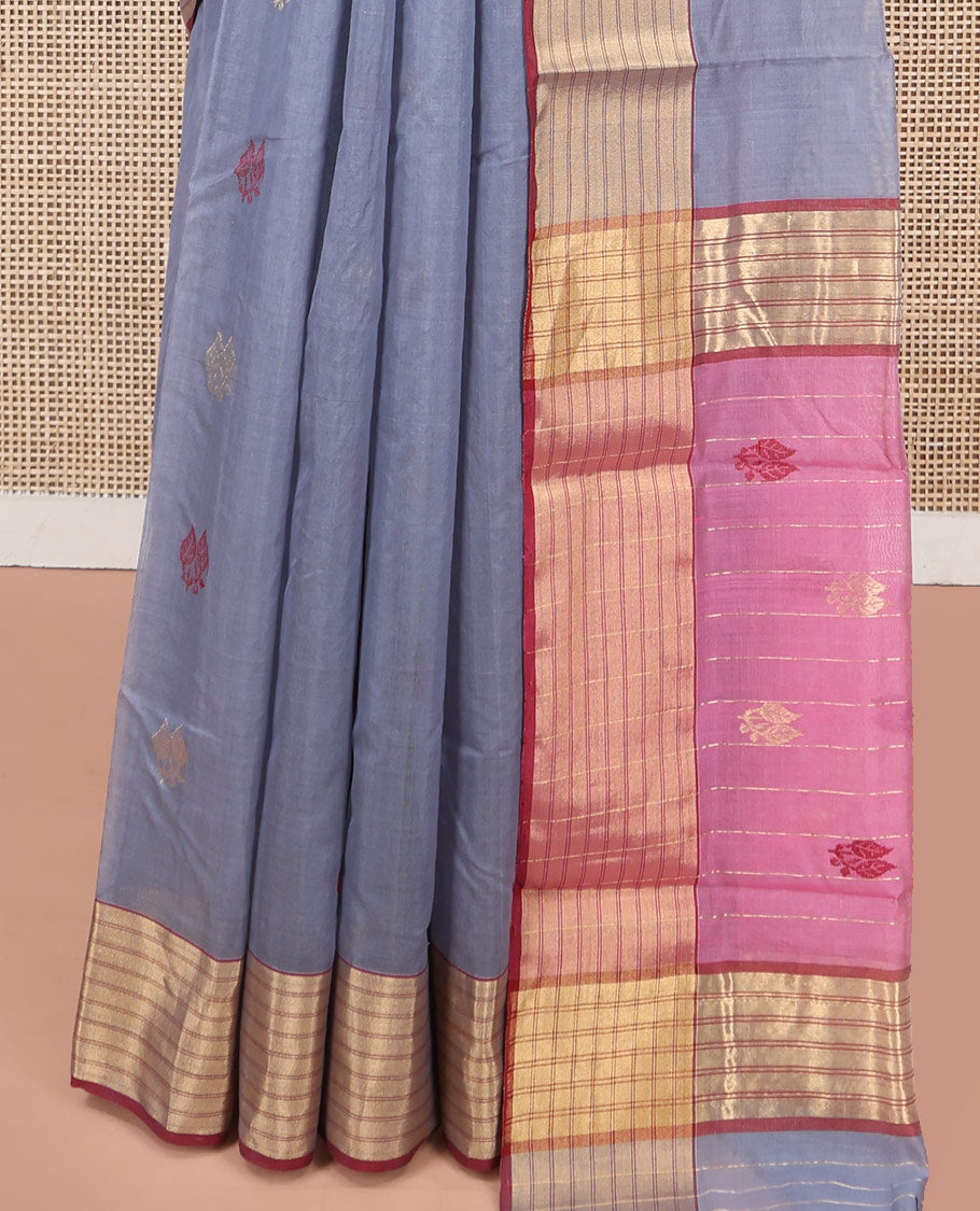 Grey Chanderi Cotton Saree, Delicately Woven with Leaf Buttas All Over Its Body, Complemented by a Contrast Zari Striped Border, Complemented by Contrast Pallu of Leaf Designs, and Paired with a Contrast Blouse