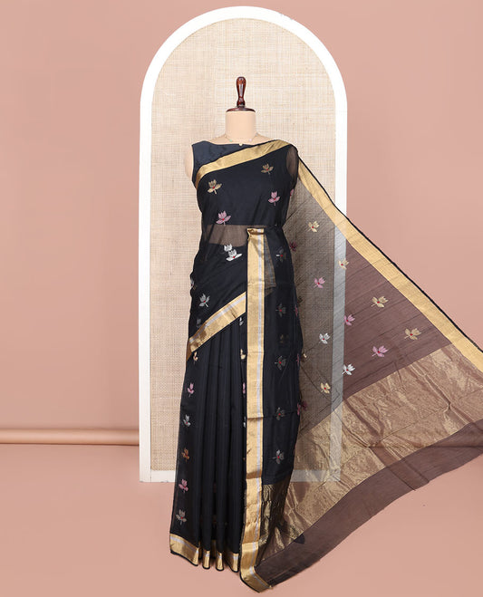 Black Chanderi Cotton Saree, Embellished with Floral Buttas All Over Its Body, Highlighted by Zari Border, Pallu Steeped with Zari Stripes, and Paired with a Matching Blouse