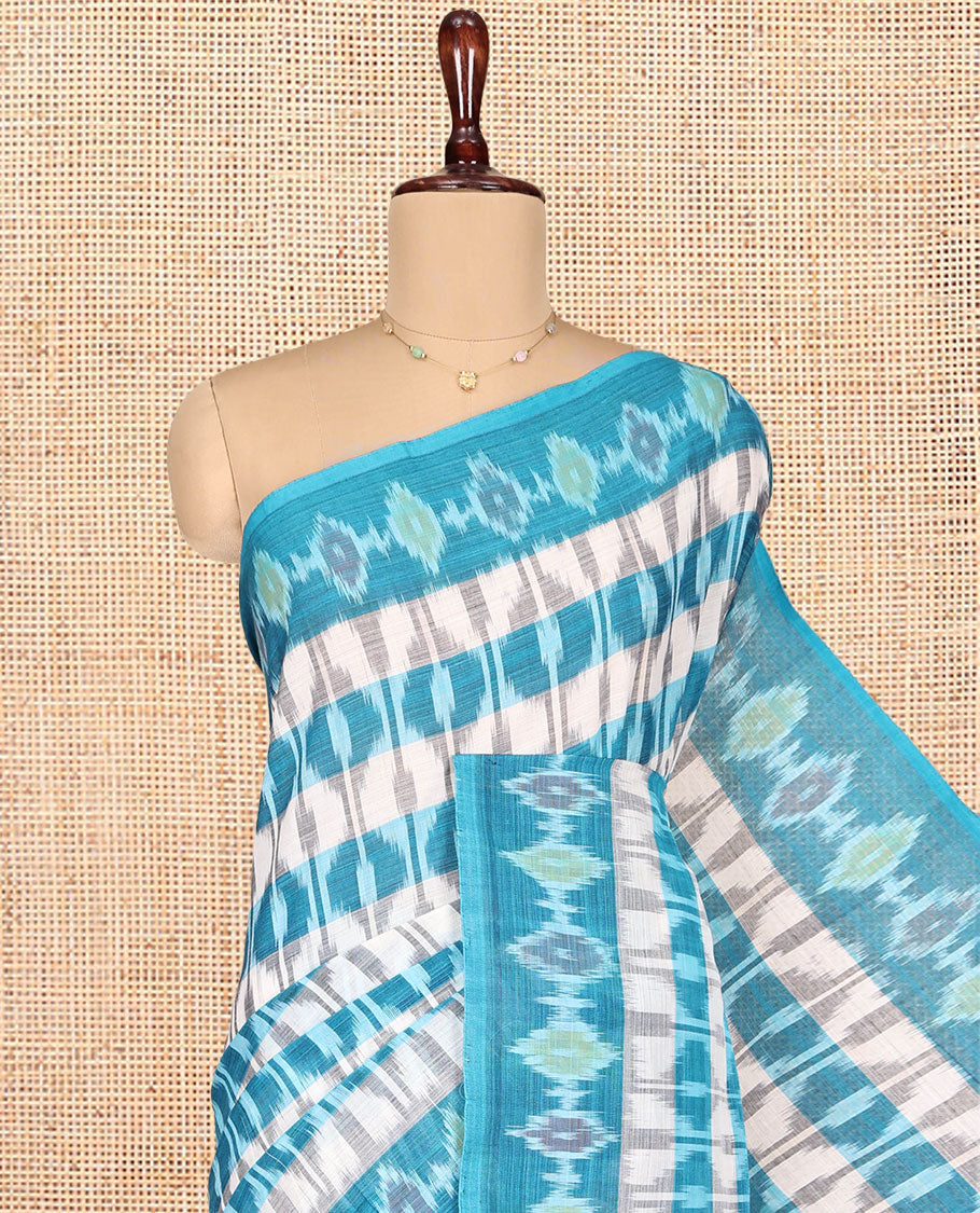 Off-White and Blue Ikkat Cotton Saree, Bedecked with Ikkat Checks All Over Its Body, Subtly Sparkled Ikkat-Textured Border, Ikkat-Textured Pallu, and Has No Blouse