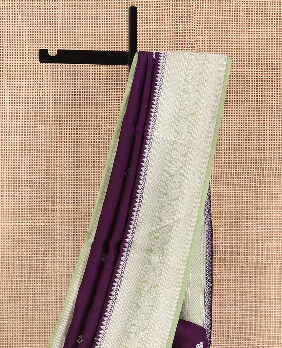 Purple Raw Mango Silk Saree Highlighted by Floral Buttas, Featuring a Contrast Traditional Zari Design Border, a Pallu Elevated with Chevron Stripes, Paired with a Contrast Brocade Blouse