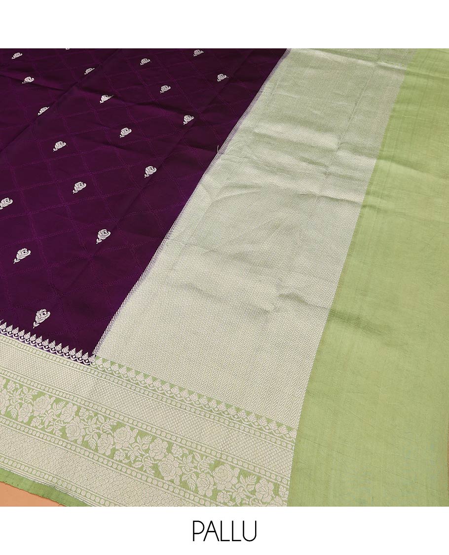 Purple Raw Mango Silk Saree Highlighted by Floral Buttas, Featuring a Contrast Traditional Zari Design Border, a Pallu Elevated with Chevron Stripes, Paired with a Contrast Brocade Blouse