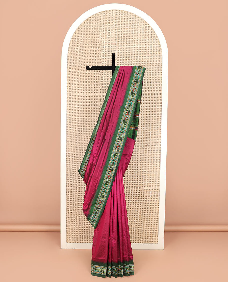 Magenta Plain Ikkat Silk Saree with a Contrast Green Border Complemented by a Hazy Ikkat Weave, Featuring a Pallu Flanked by Stripes and Ikkat Texture
