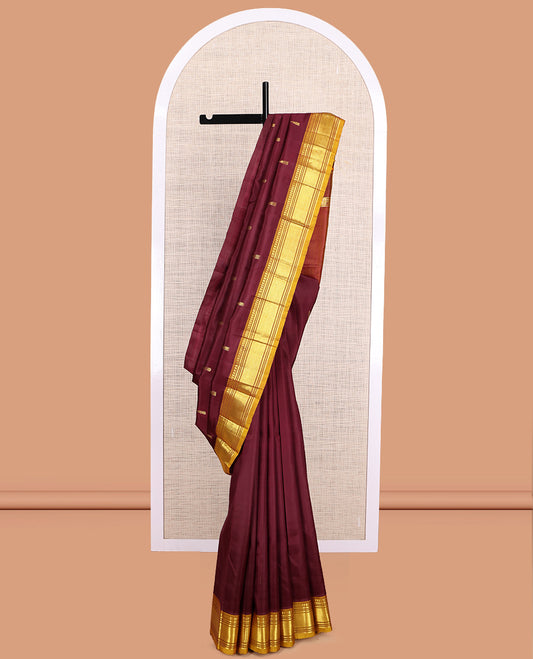 Maroon Kanchipuram Silk Saree, Accentuated with Zari Buttas, a Contrast One-Sided Border of Paneer Sombu, Rekku, Banaras, Muthu, and Mayil Kann Design, Zari Design Pallu, and No Blouse