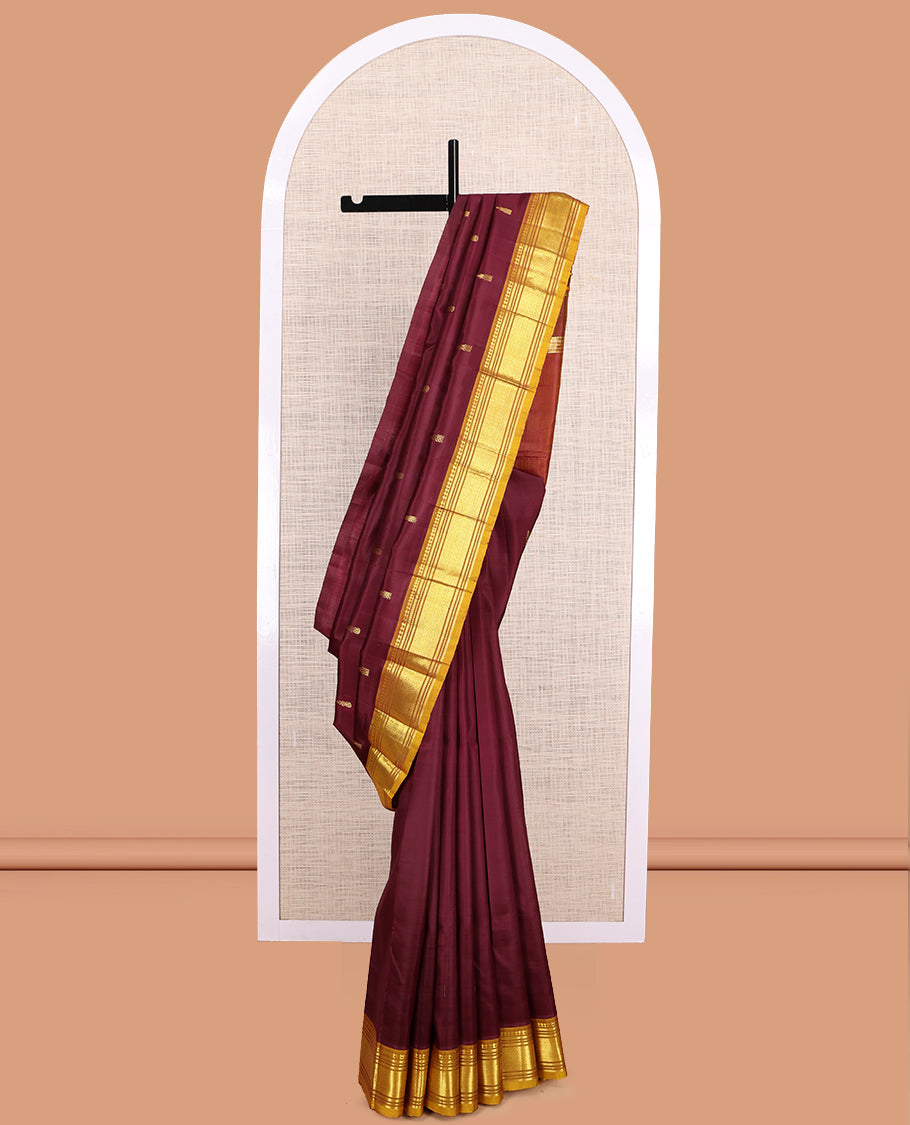 Maroon Kanchipuram Silk Saree, Accentuated with Zari Buttas, a Contrast One-Sided Border of Paneer Sombu, Rekku, Banaras, Muthu, and Mayil Kann Design, Zari Design Pallu, and No Blouse