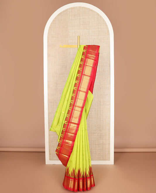 Green zari buttas Kanchipuram silk saree, contrast one-sided thazampoo rekku border of thilakam mokku & paayadi kann & zari design pallu
