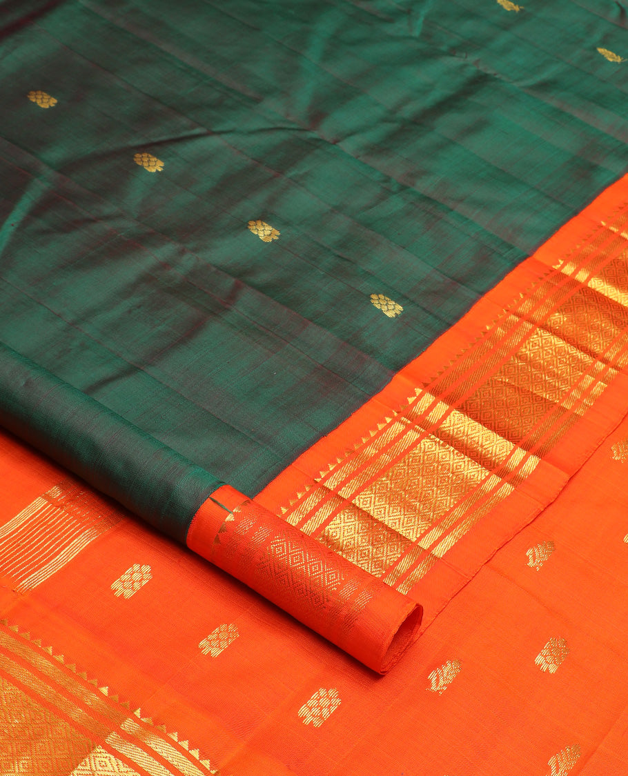 Green zari buttas Kanchipuram silk saree, contrast one-sided korvai border of rekku, banaras, and jaal design, and zari design pallu