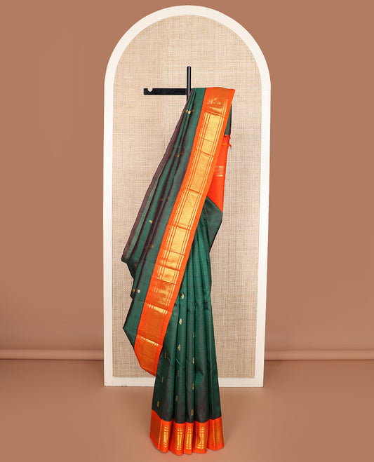 Green zari buttas Kanchipuram silk saree, contrast one-sided korvai border of rekku, banaras, and jaal design, and zari design pallu