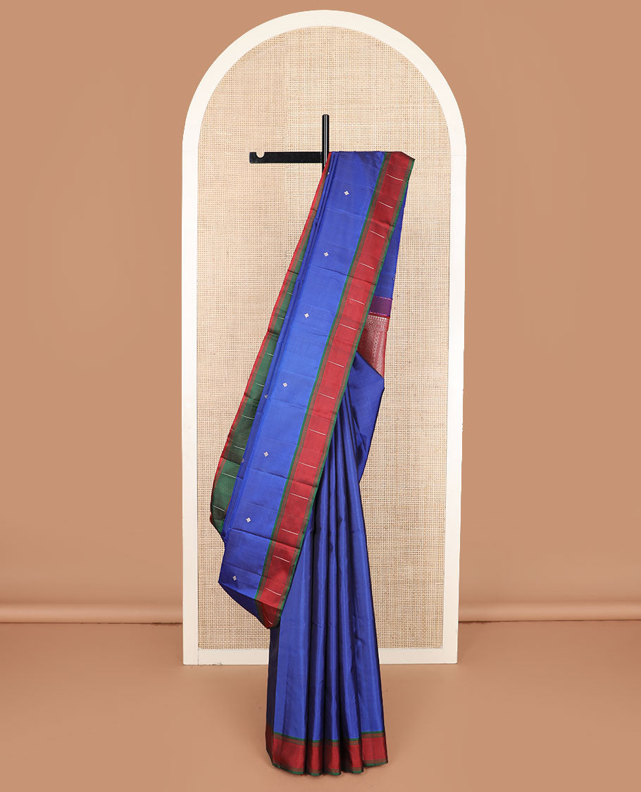 Royal blue buttas Kanchipuram silk saree, contrast border of malli mokku designs, and pallu of geometric designs