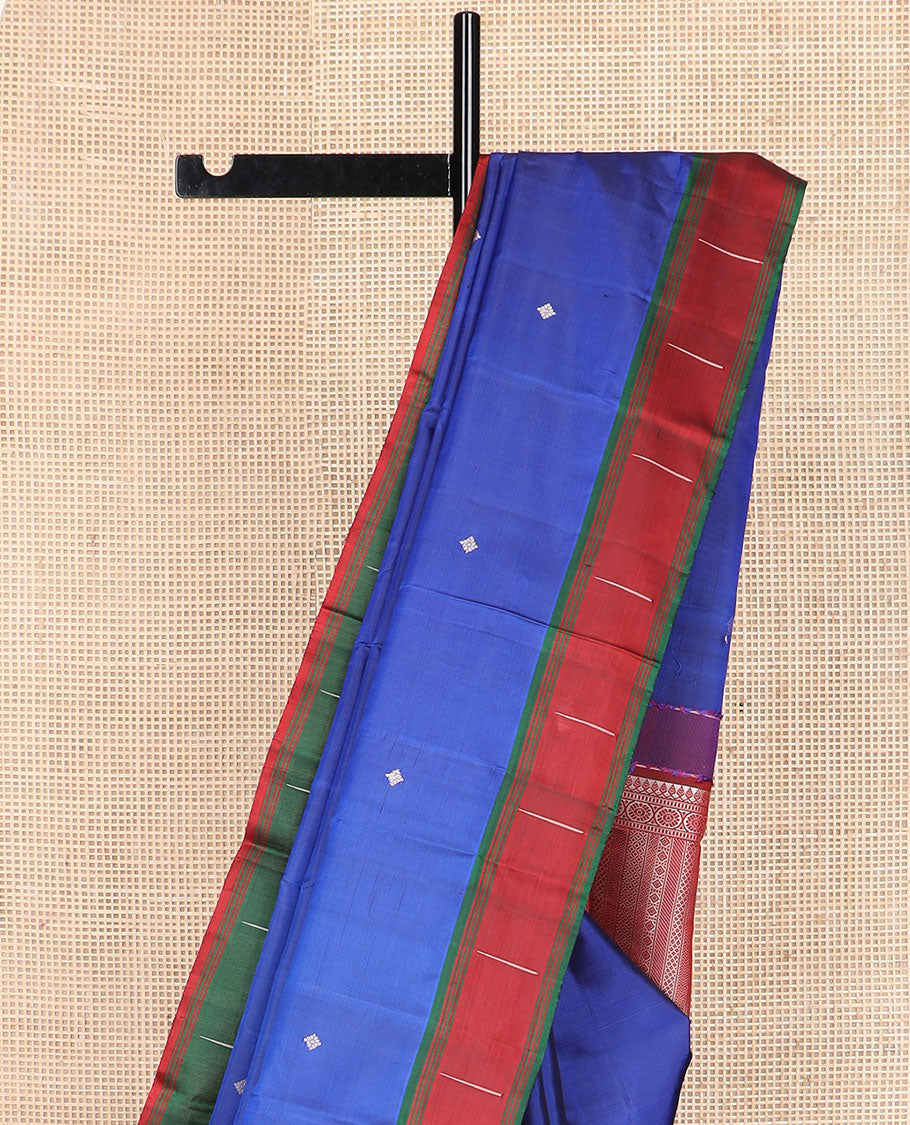 Royal blue buttas Kanchipuram silk saree, contrast border of malli mokku designs, and pallu of geometric designs