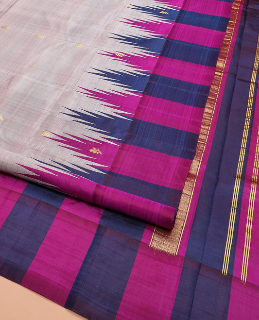 Grey Kanchipuram Silk Saree Detailed with Zari Buttas All Over Its Body, Complemented by Contrast One-Sided Thazampoo Rekku Border of  Zari Buttas, Zari Design Pallu, and Comes Without a Blouse