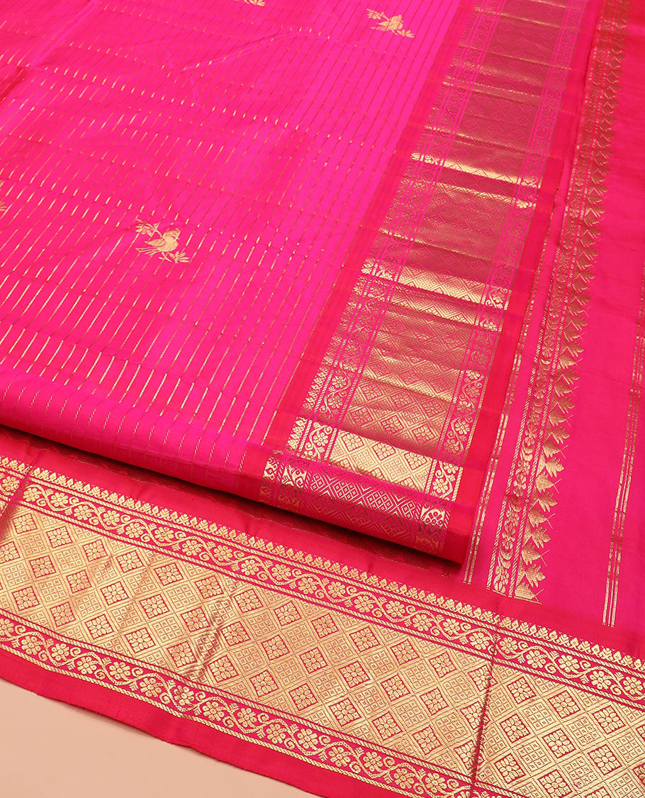 Rani Pink Kanchipuram Silk Saree Graced with Mayil Buttas and Zari Stripes All Over Its Body, Complemented by Contrast One-Sided Border of Kodi Visiry and Jaal Designs, Grandly Woven Pallu of Geometric Patterns, and Comes Without a Blouse
