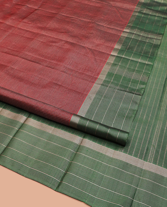 Maroon Kanchipuram Silk Saree Spotlighted Kasa Kasa Checks All Over Its Body, Complemented by a Contrast Border of Zari Stripes, Featuring Pallu of Seppu Rekku Designs, and Paired with a Contrast Blouse