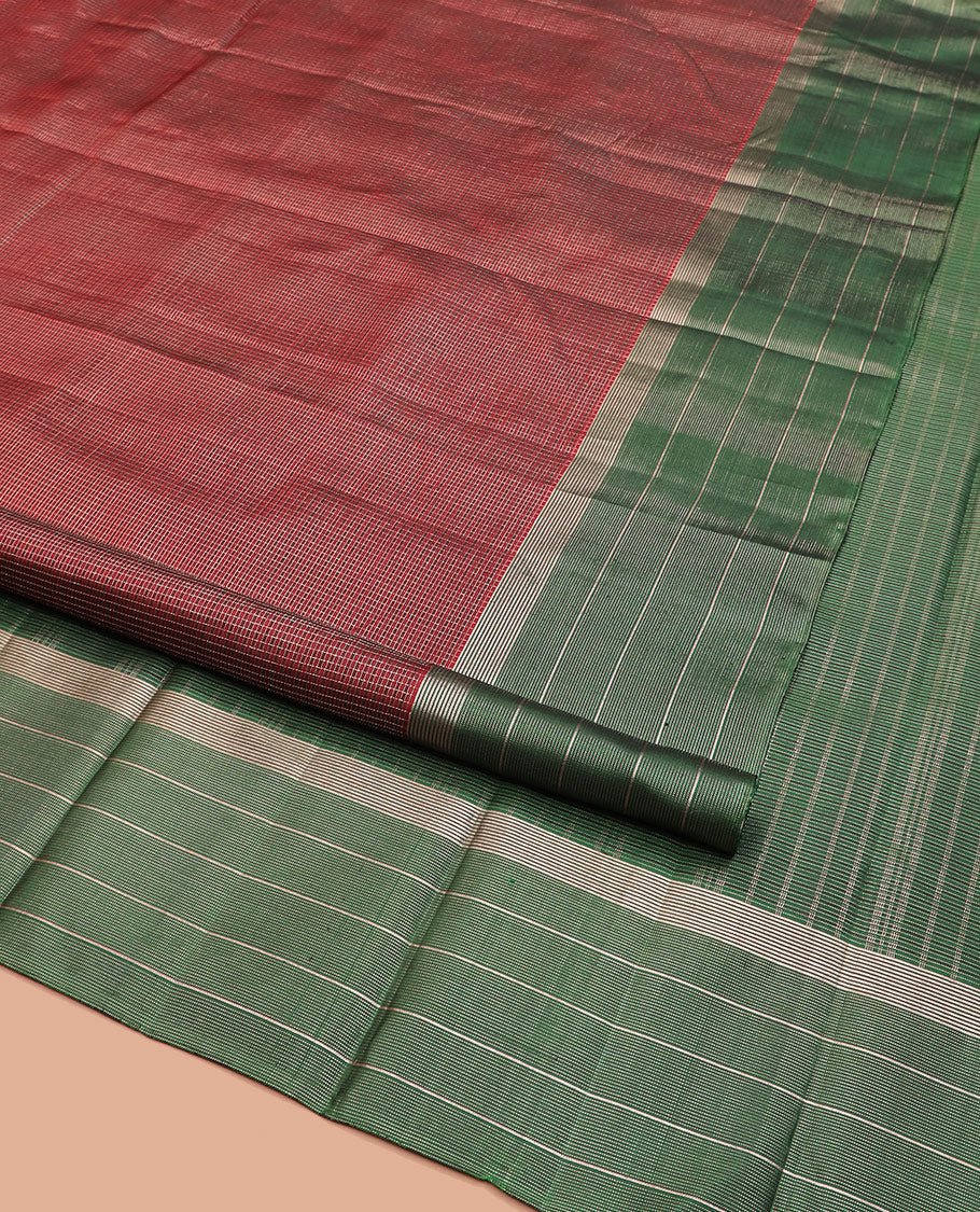 Maroon Kanchipuram Silk Saree Spotlighted Kasa Kasa Checks All Over Its Body, Complemented by a Contrast Border of Zari Stripes, Featuring Pallu of Seppu Rekku Designs, and Paired with a Contrast Blouse