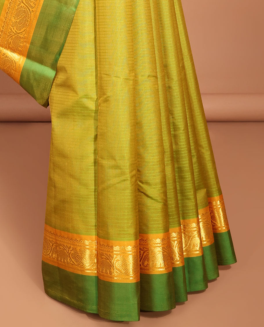 Green kancheepuram silk saree with contrast intricate zari design pallu & striped, round buttas pallu