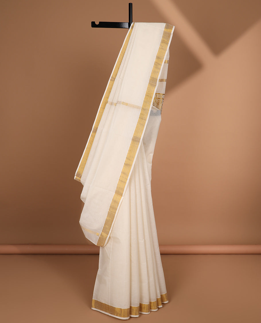 Cream kerala saree with zari designs, plain border & pallu of intricate zari designs