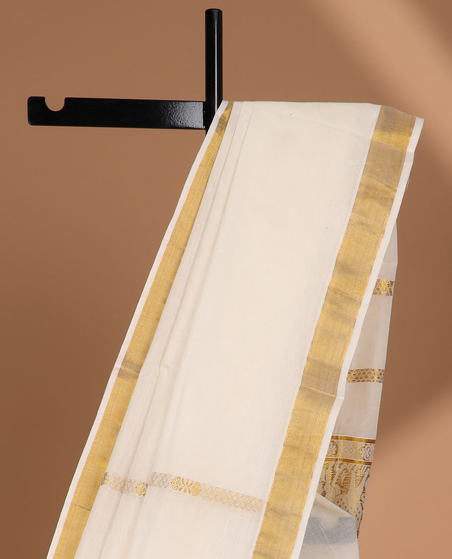 Cream kerala saree with zari designs, plain border & pallu of intricate zari designs