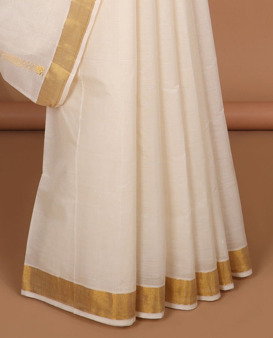 Cream kerala saree with zari designs, plain border & pallu of intricate zari designs