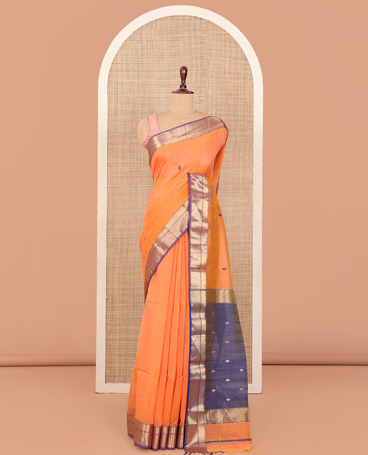 Orange Maheshwari Cotton Saree, Delicately Woven with Thread Buttas All Over Its Body, Complemented by Contrast Traditional Zari Design Border, Pallu Steeped with Zari Buttas, and Paired with a Contrast Blouse