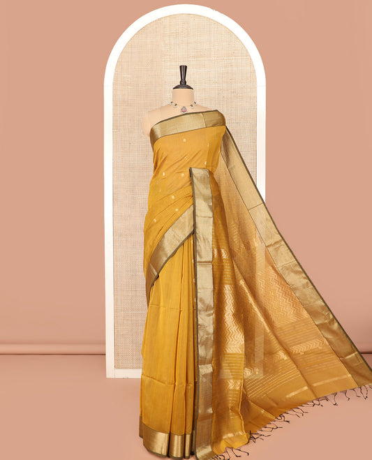 Yellow Maheshwari Cotton Saree Elevated with Floral Buttas, Highlighted with a Chevron Striped Zari Border, Pallu Steeped with Zari Stripes and Chevron Stripes, and Paired with a Matching Blouse