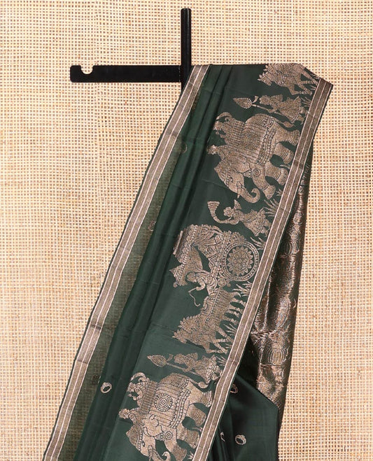 Green Mayuri Soft Silk Saree, Richly Detailed with Ring Buttas All Over Its Body, Highlighted by a Zari Border of Wedding-Style Bride and Groom Motifs Weave, Sparsely Woven Pallu with Wedding-Related Motifs, and Paired with a Matching Blouse