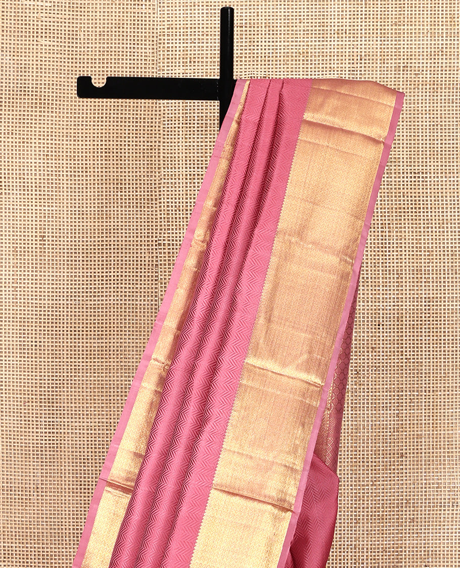 Pink Embossed Parampara Silk Saree, Highlighted by Zari Border of Thilakam and Vanki Designs, Pallu Steeped with Rudraksham Designs, and Paired with a Matching Blouse