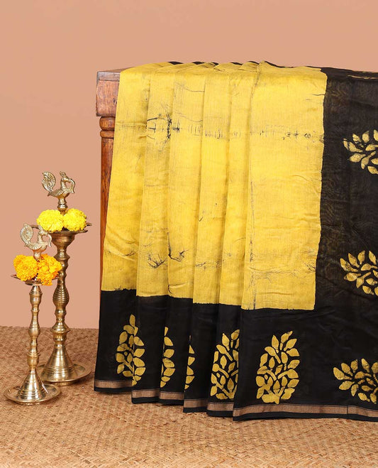 Yellow hanblock batik printed chanderi cotton saree with contrast wax block printed border & hand block printed pallu along with plain blouse