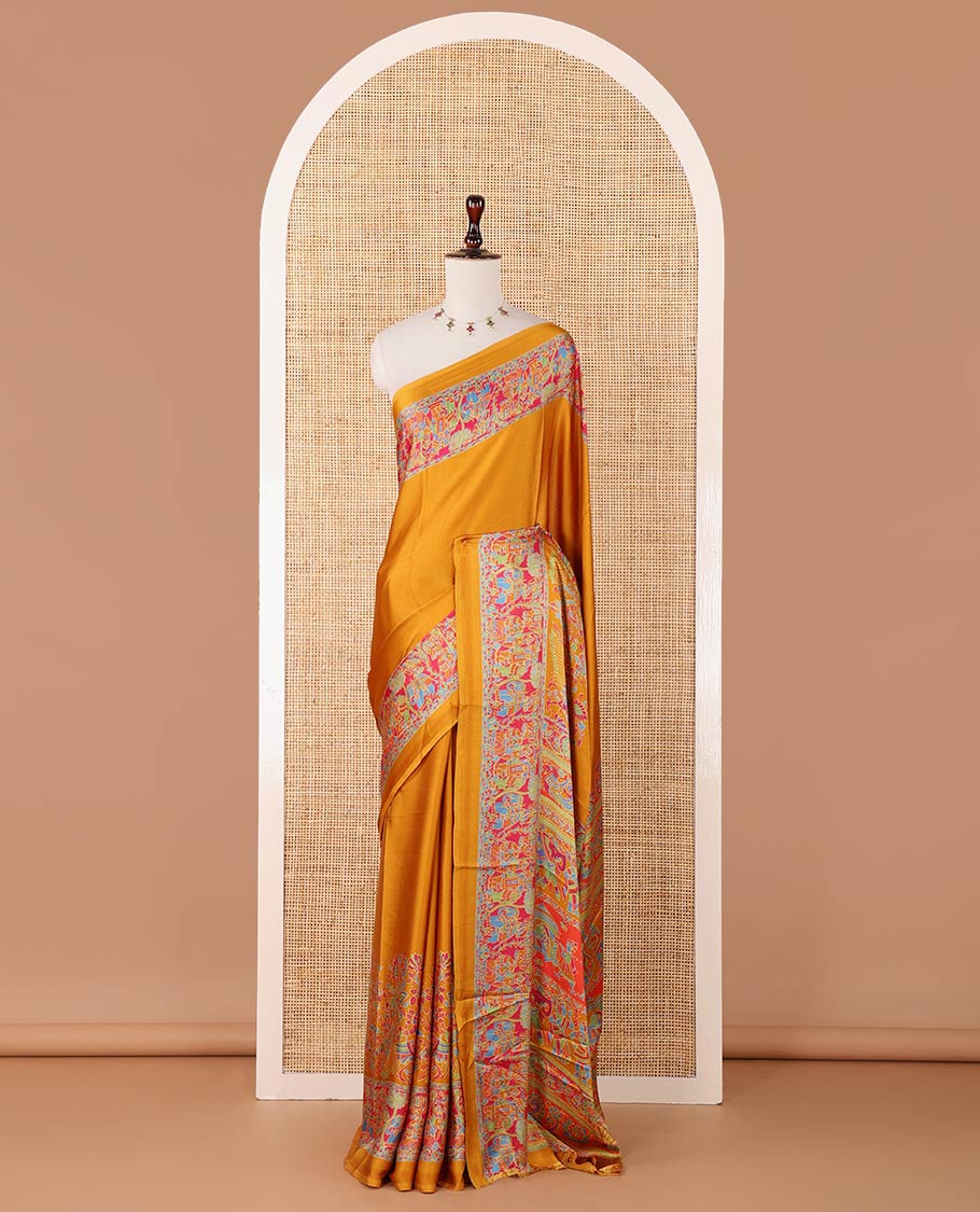 Mustard plain gajji silk saree, double-sided position printed border & pallu of animal & human motifs, with floral printed blouse