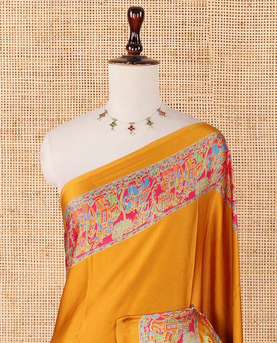Mustard plain gajji silk saree, double-sided position printed border & pallu of animal & human motifs, with floral printed blouse