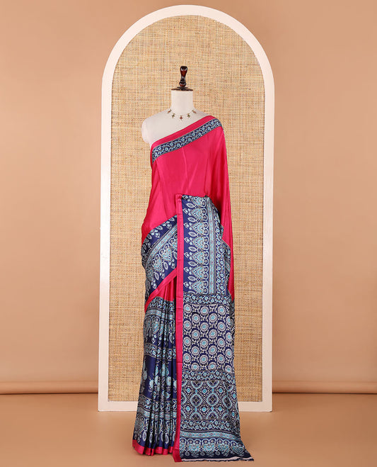 Pink half-plain & half-printed gajji silk saree, contrast blue border & pallu of ajrakh-print with printed blouse