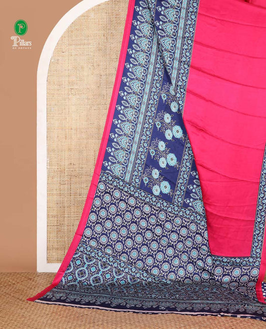 Pink half-plain & half-printed gajji silk saree, contrast blue border & pallu of ajrakh-print with printed blouse