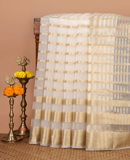 Half-white veldhari zari design semi-organza saree, gold zari floral creeper border, zari design pallu & blouse