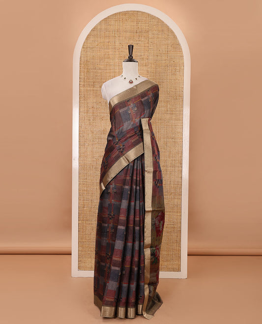 Multi-color geometric-abstract printed black spun linen saree, gold zari piping border, floral motifs printed pallu & striped blouse