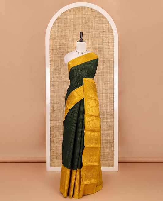 Bottle green zari checked Sungudi cotton saree, contrast zari border decked up with peacock motifs, zari striped pallu & contrast veldhari stripes blouse